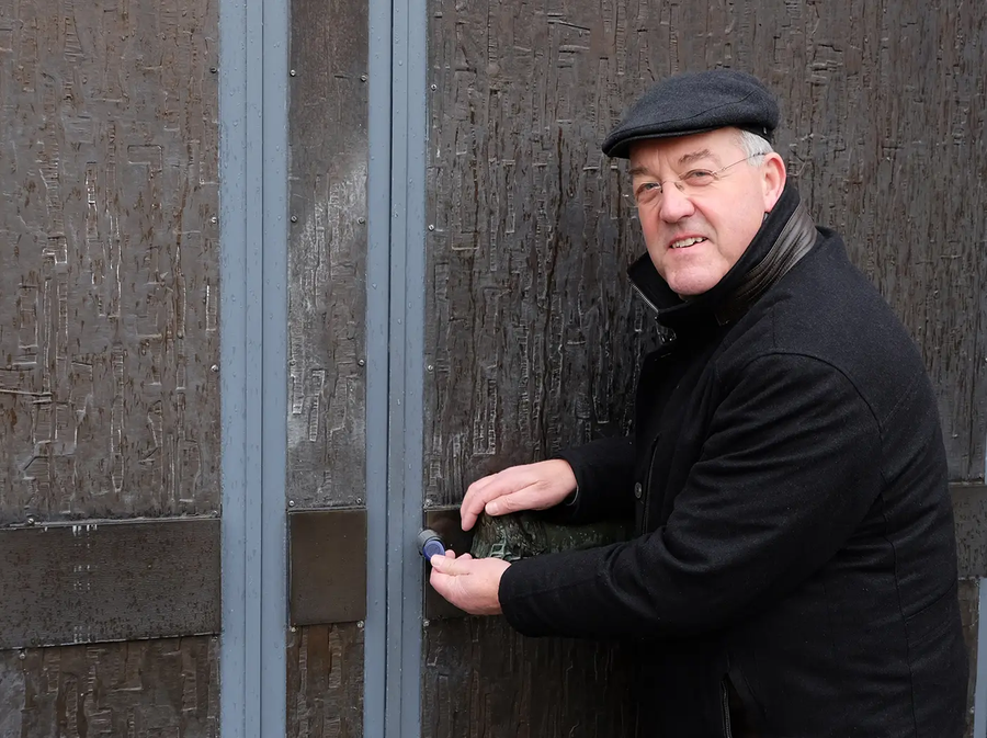 Pastor Herbert Werth in Front of the Church Door